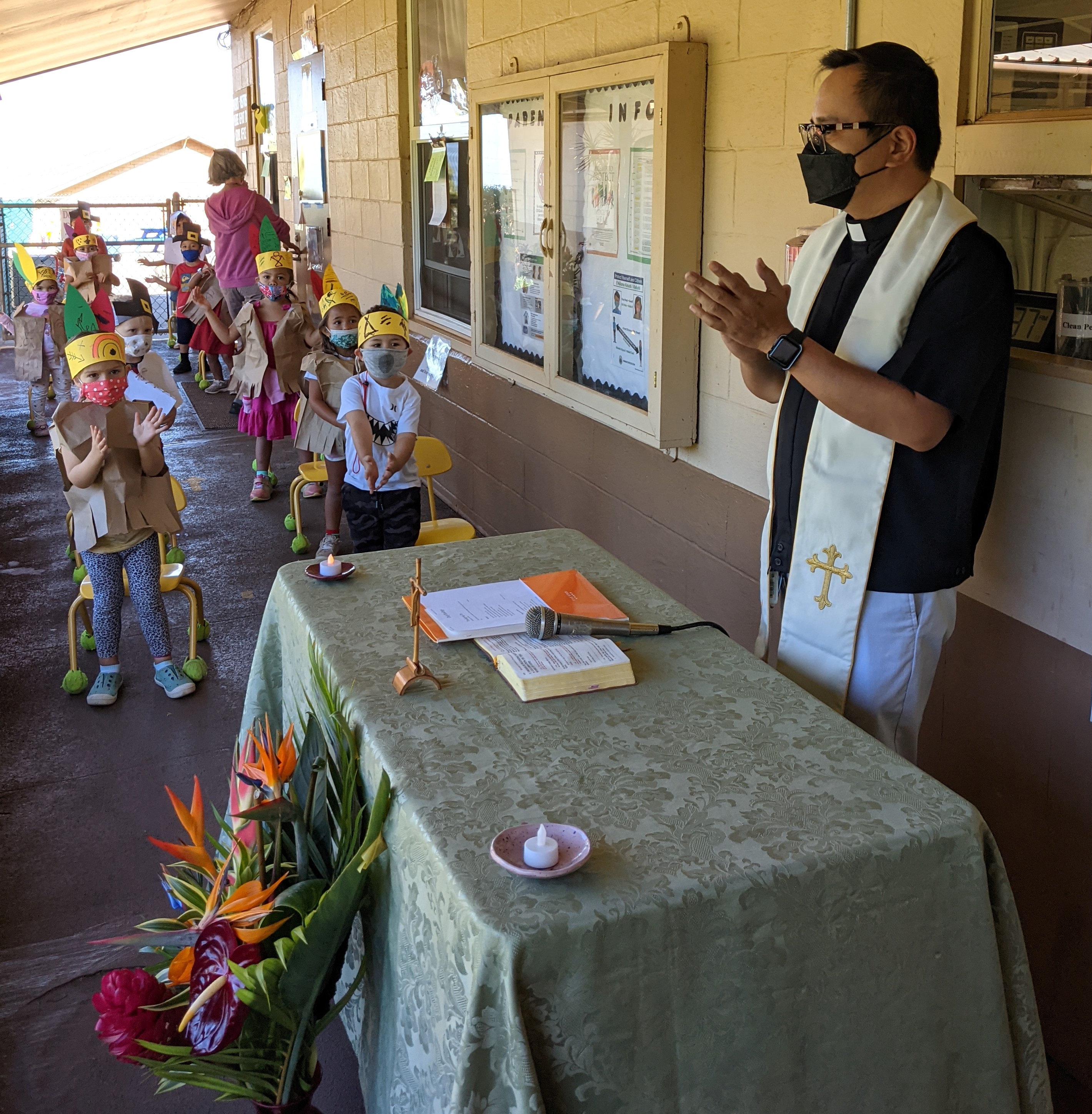 Father Tolentino leading Thanksgiving prayer